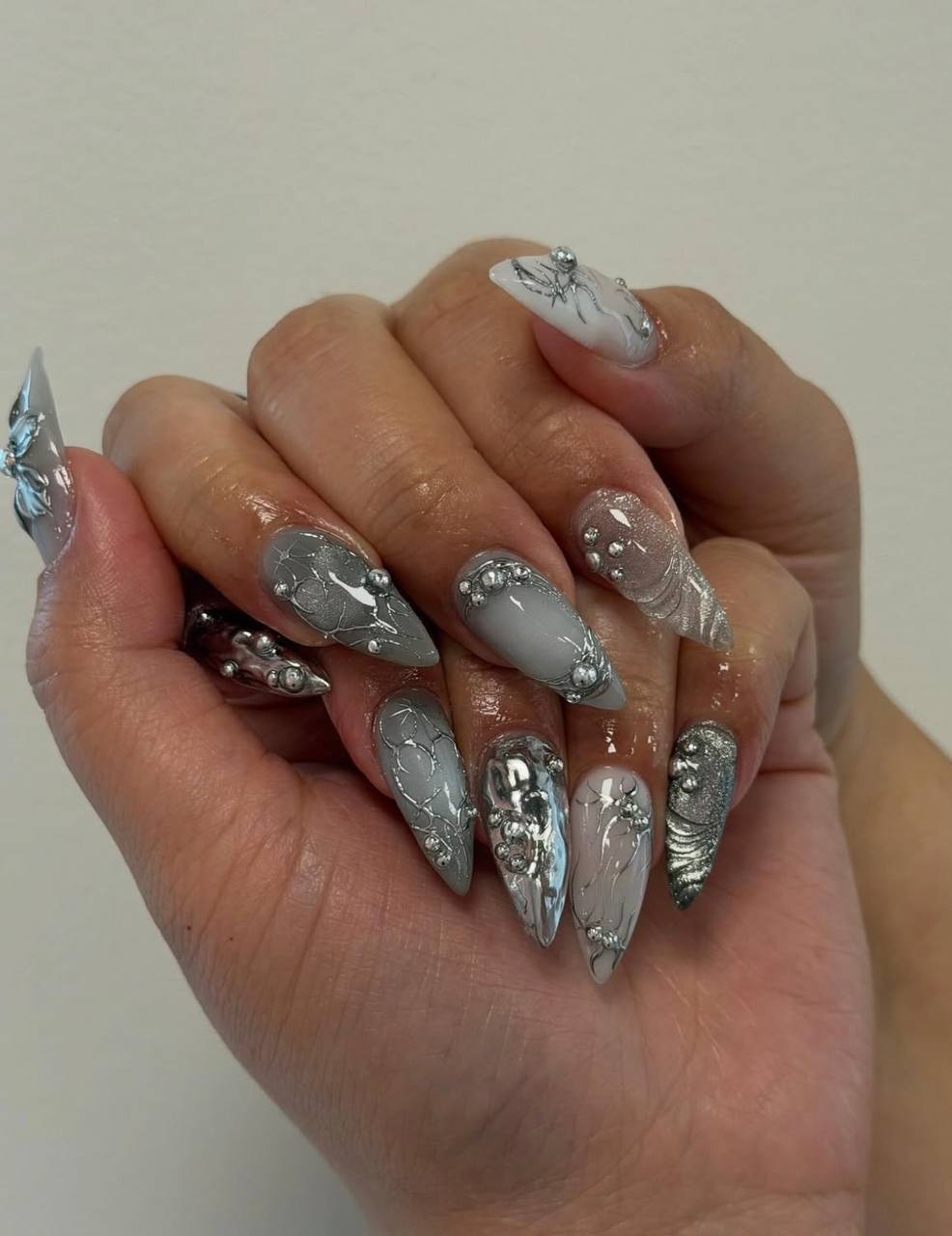 Grey crackle nails with silver chrome and beads