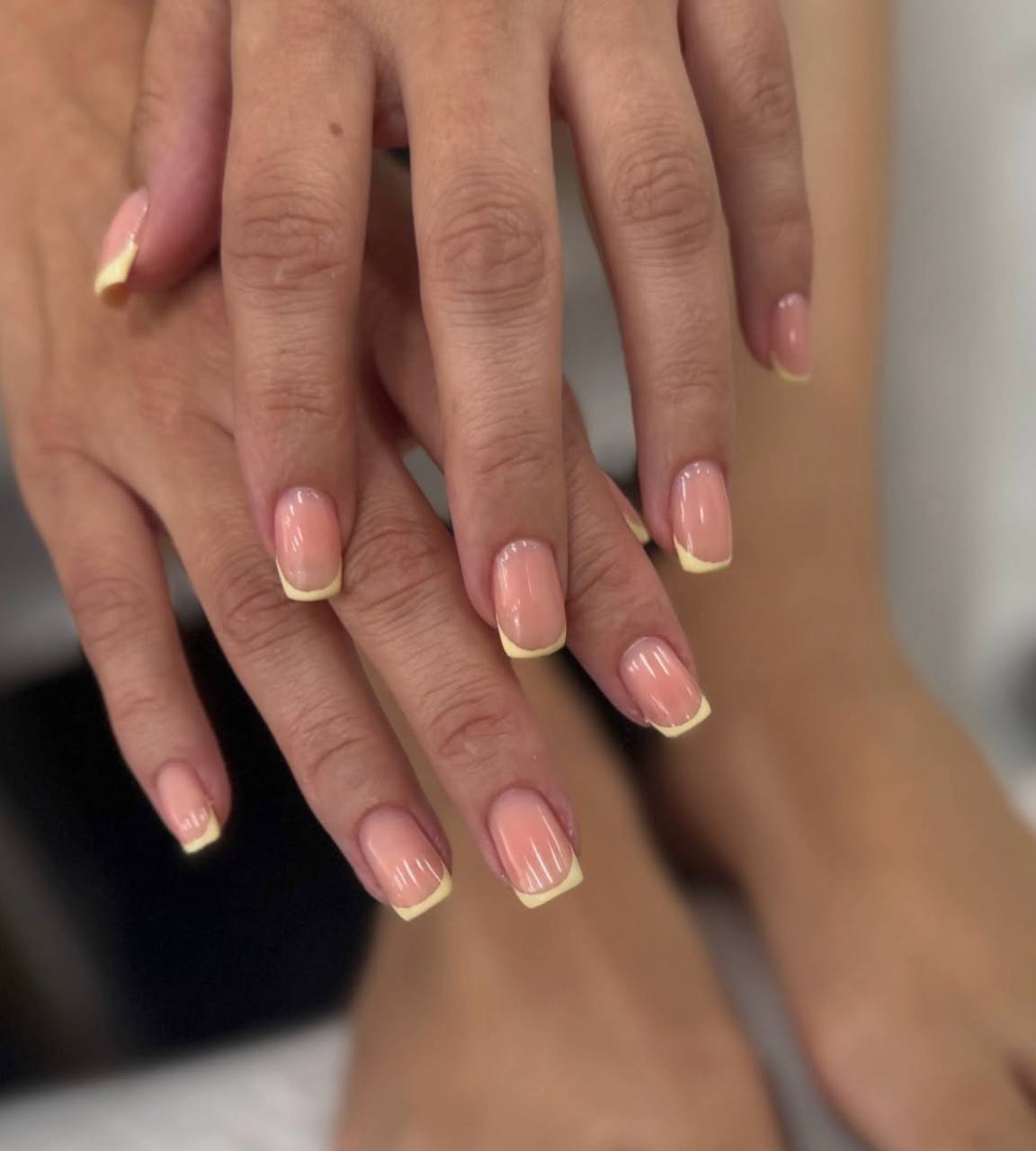 Natural almond nails with thin white French tips